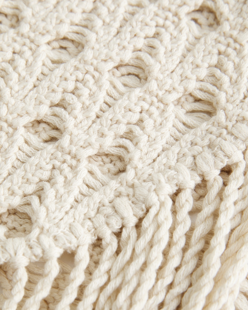 loose-fitting crocheted fringed vest
